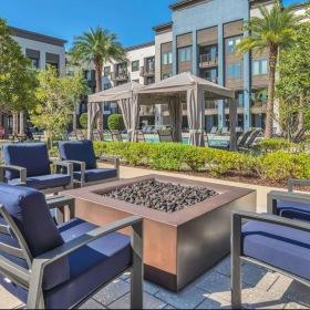 Settle into comfort at Avere chairs around outdoor fire pit