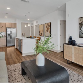 Relax and unwind in stylish living spaces furnished living room open to kitchen